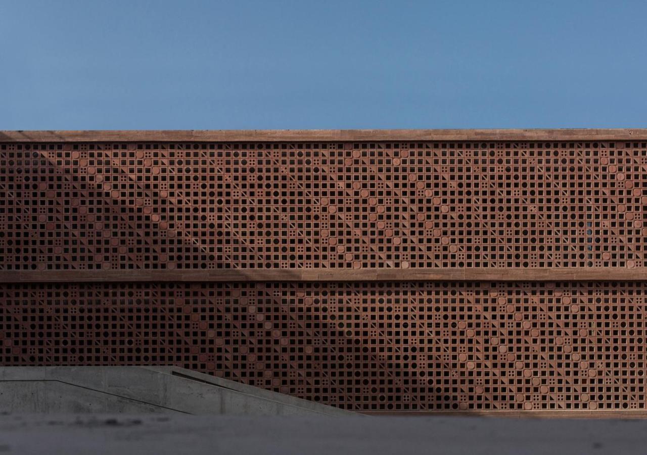 Potato Head Suites & Studios Seminyak  Exterior photo The perforated brick facade